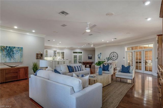 a kitchen with counter top space and wooden floor