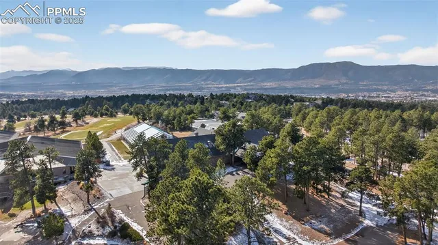 a view of a house with a mountain