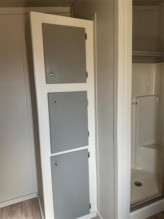 1109 Market Street Tye, TX 79563 - Photo 11 of 20 a bathroom with a glass door shower and a sink