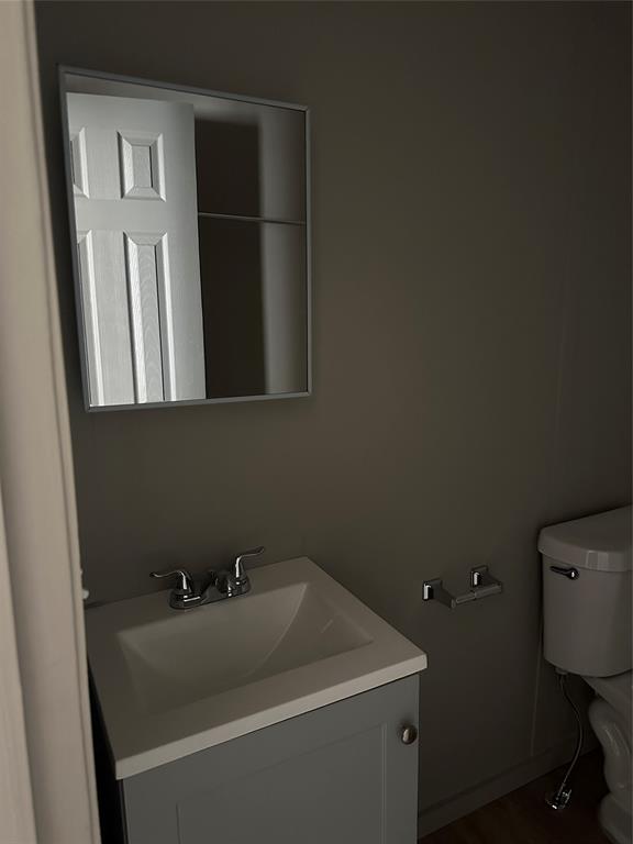 1109 Market Street Tye, TX 79563 - Photo 15 of 20 a bathroom with a sink and a toilet