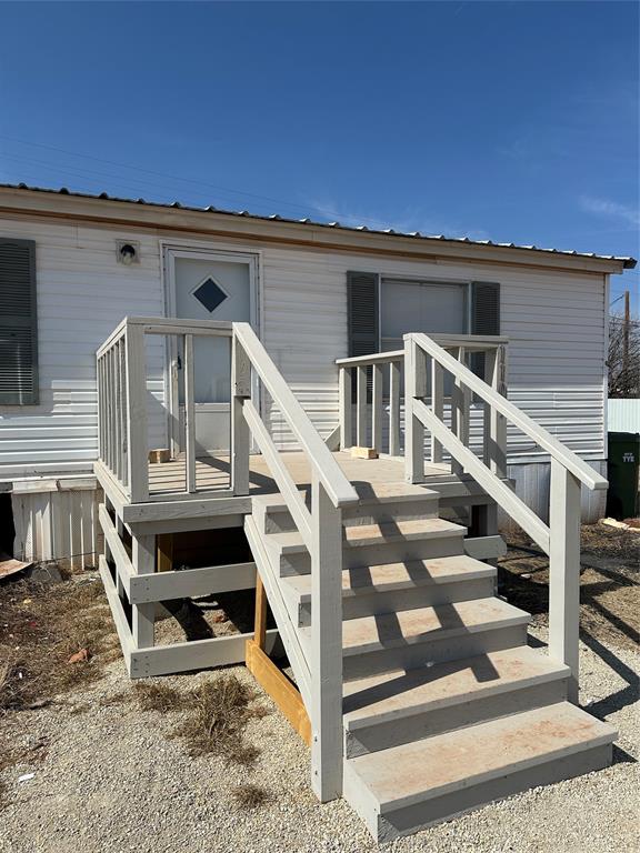 1109 Market Street Tye, TX 79563 - Photo 20 of 20 a view of a house with wooden deck