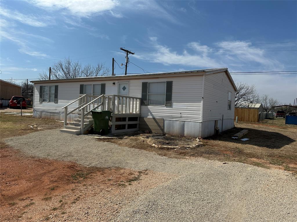 1109 Market Street Tye, TX 79563 - Photo 2 of 20 a view of a house with backyard and roof