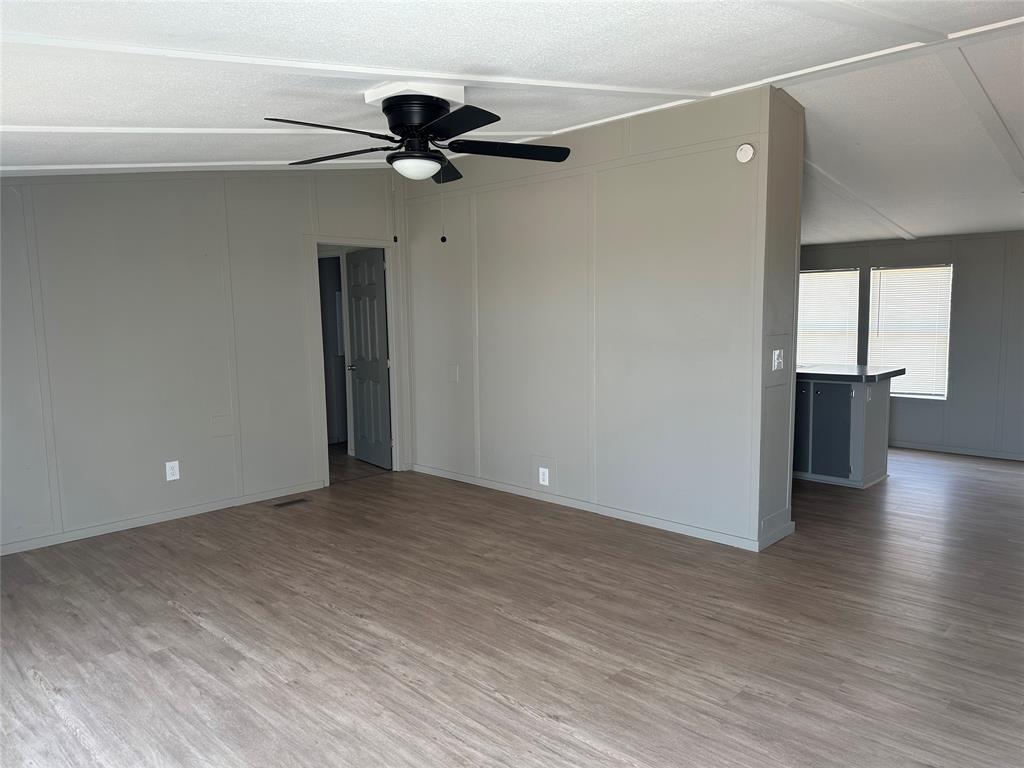 1109 Market Street Tye, TX 79563 - Photo 3 of 20 a view of empty room with wooden floor and window