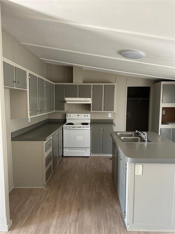 1109 Market Street Tye, TX 79563 - Photo 6 of 20 a kitchen with a sink stove and cabinets