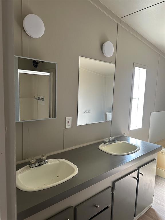 1109 Market Street Tye, TX 79563 - Photo 9 of 20 a bathroom with a sink and a mirror