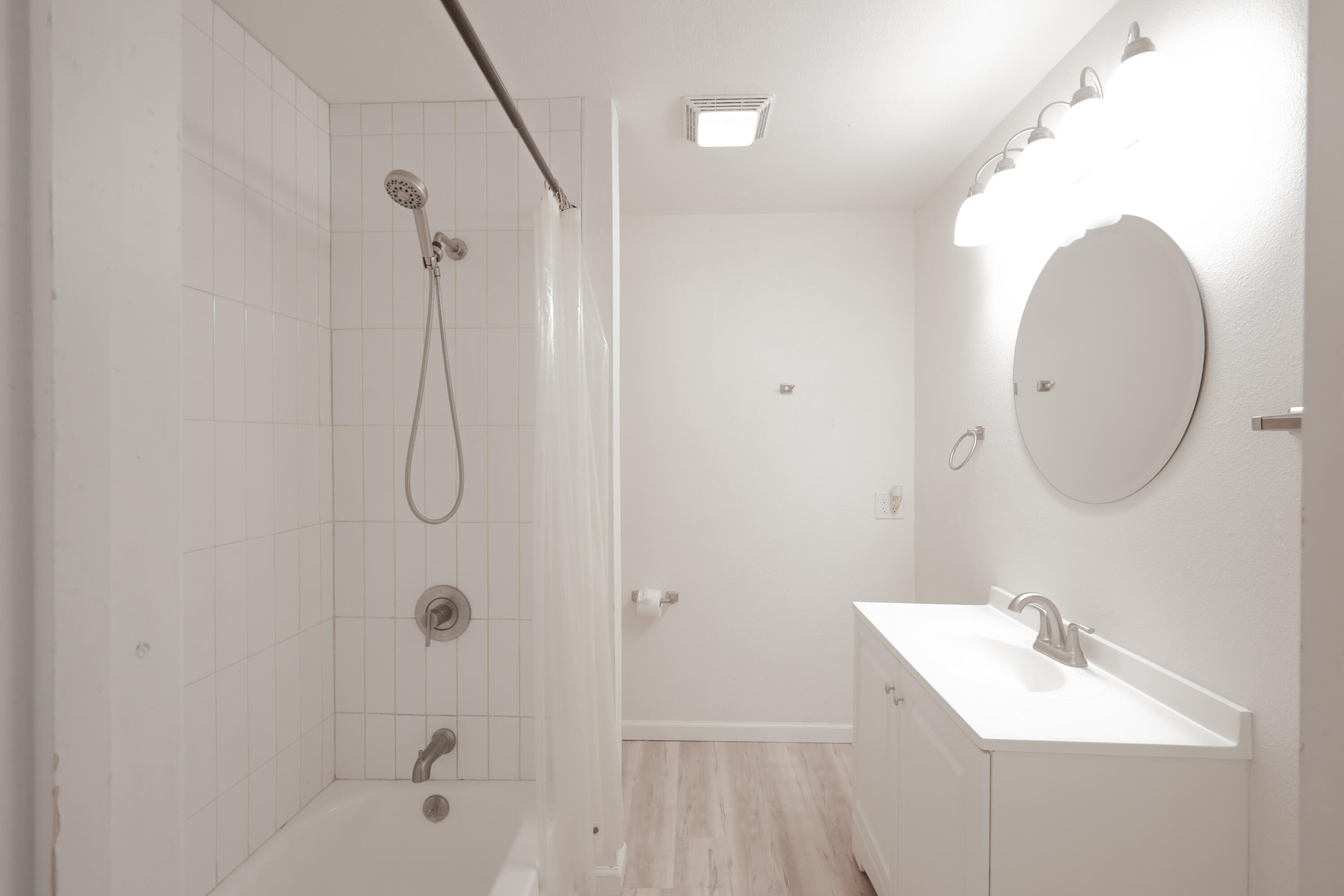 3812 31st Street Lubbock, TX 79410 - Photo 14 of 16 a bathroom with a sink a toilet and shower