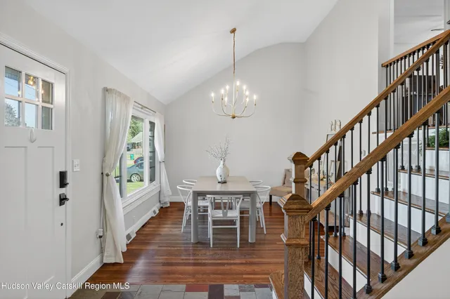 a workspace with wooden floor windows and entryway