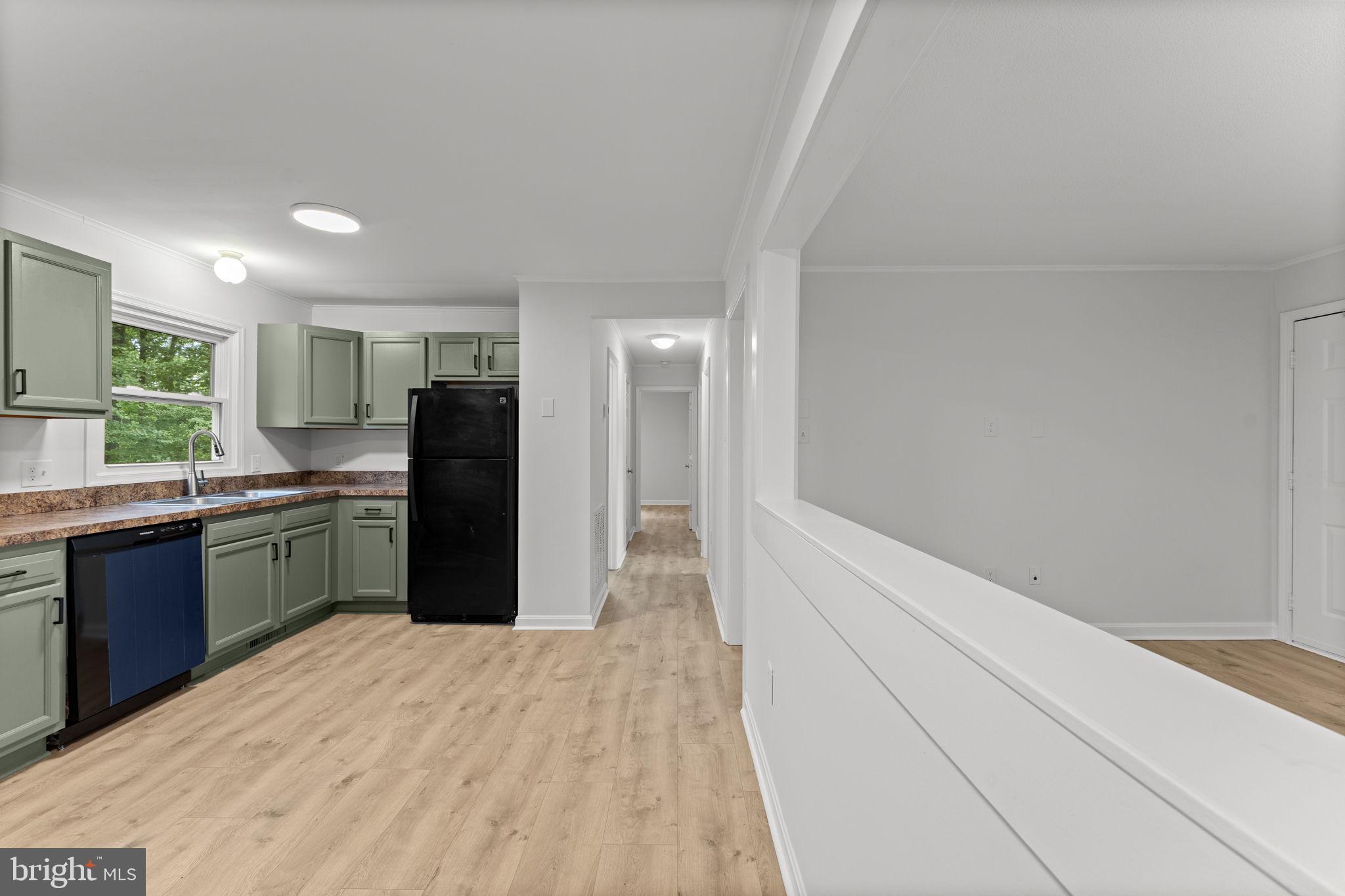1821 James City Road Reva, VA 22735 - Photo 21 of 44 a kitchen with granite countertop a refrigerator and a sink