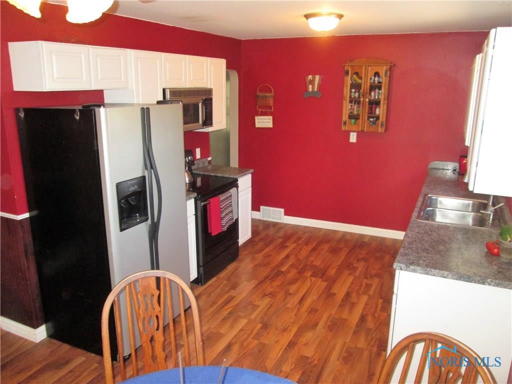 1113 Cresceus Road Oregon, OH 43616 - Photo 7 of 28 Quality waterproof laminate flooring.