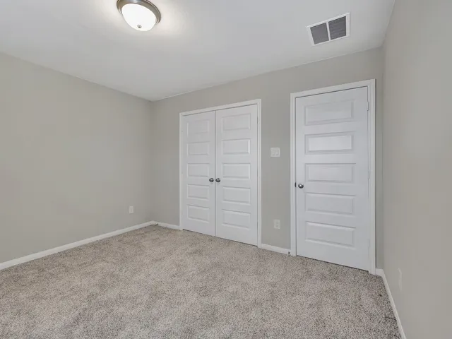 an empty room with closet