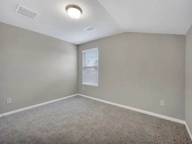 an empty room with a empty space and window