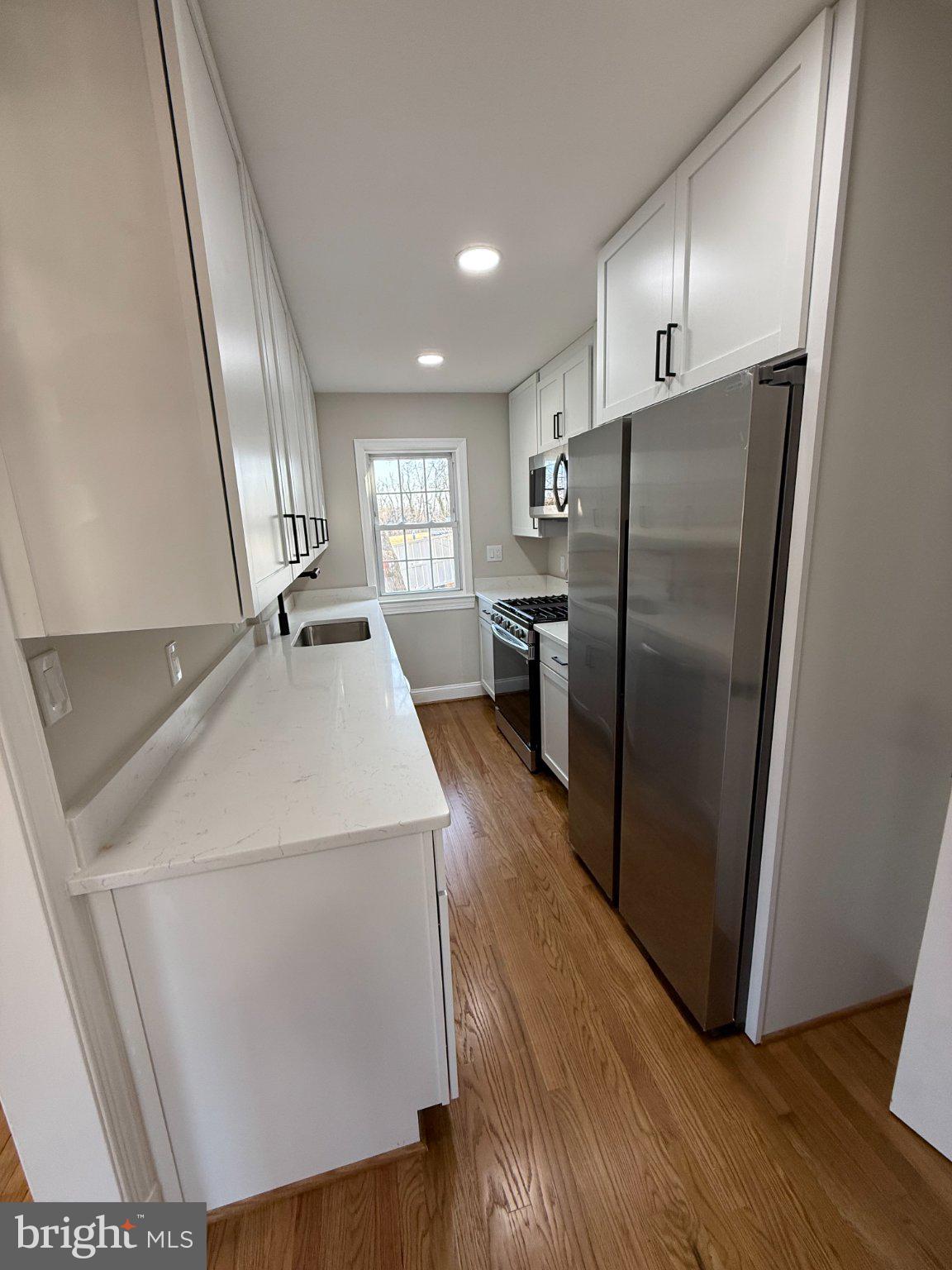 1608 13th Road South Arlington, VA 22204 - Photo 12 of 15 Modern kitchen with sleek finishes.