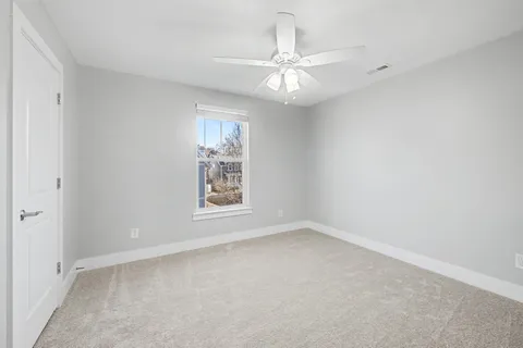 a bathroom with a granite countertop sink double and mirror