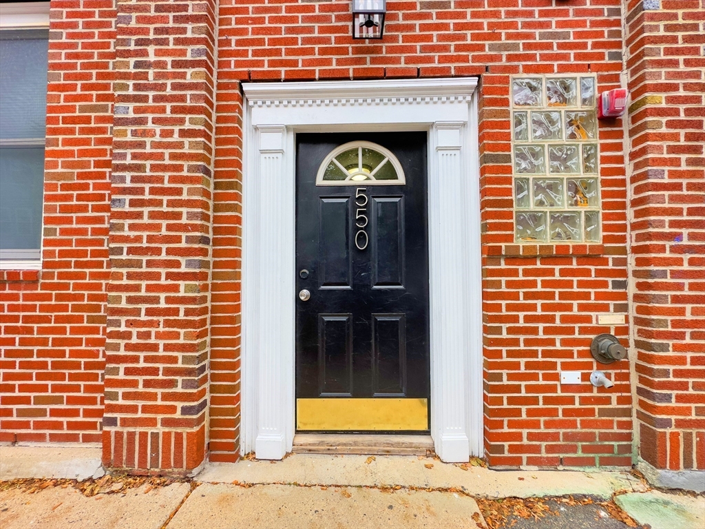 550 East 3rd Street Boston, MA 02127 - Photo 2 of 12 a front view of a building with a door
