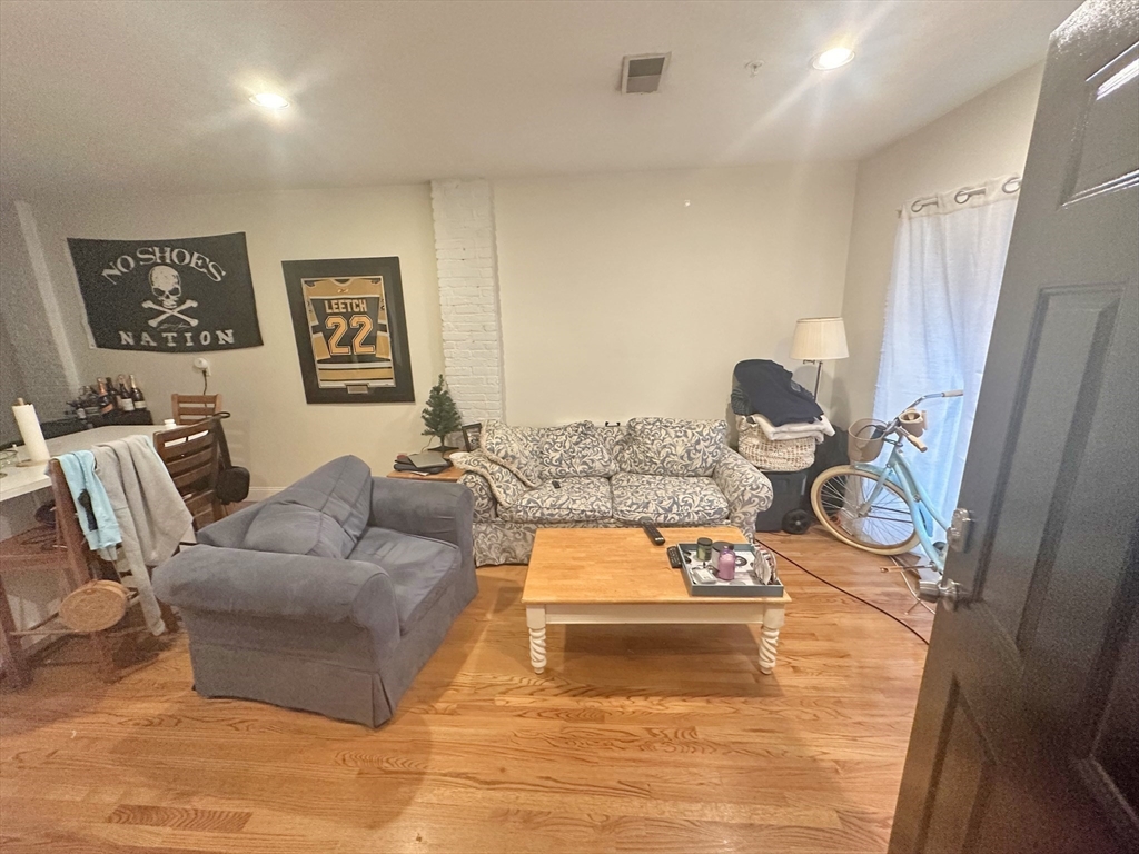 550 East 3rd Street Boston, MA 02127 - Photo 8 of 12 a living room with furniture and a window