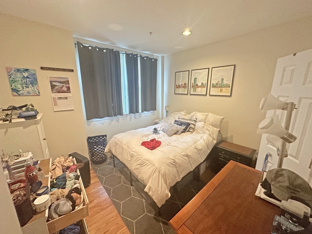 550 East 3rd Street Boston, MA 02127 - Photo 9 of 12 a bedroom with a bed and a table