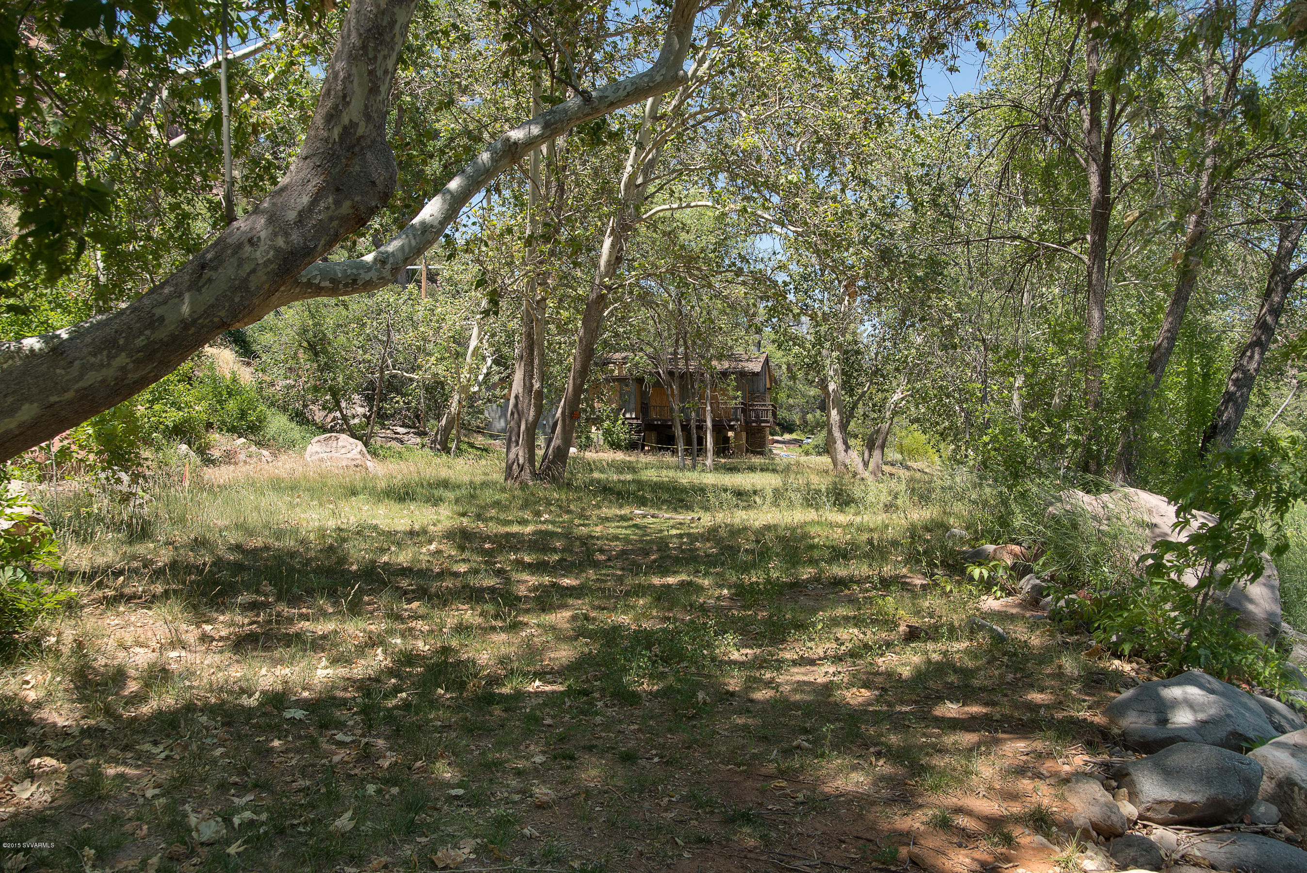 690-950 North State Rte 89A Sedona, AZ 86336 - Photo 14 of 31 a big yard with lots of green space and a house