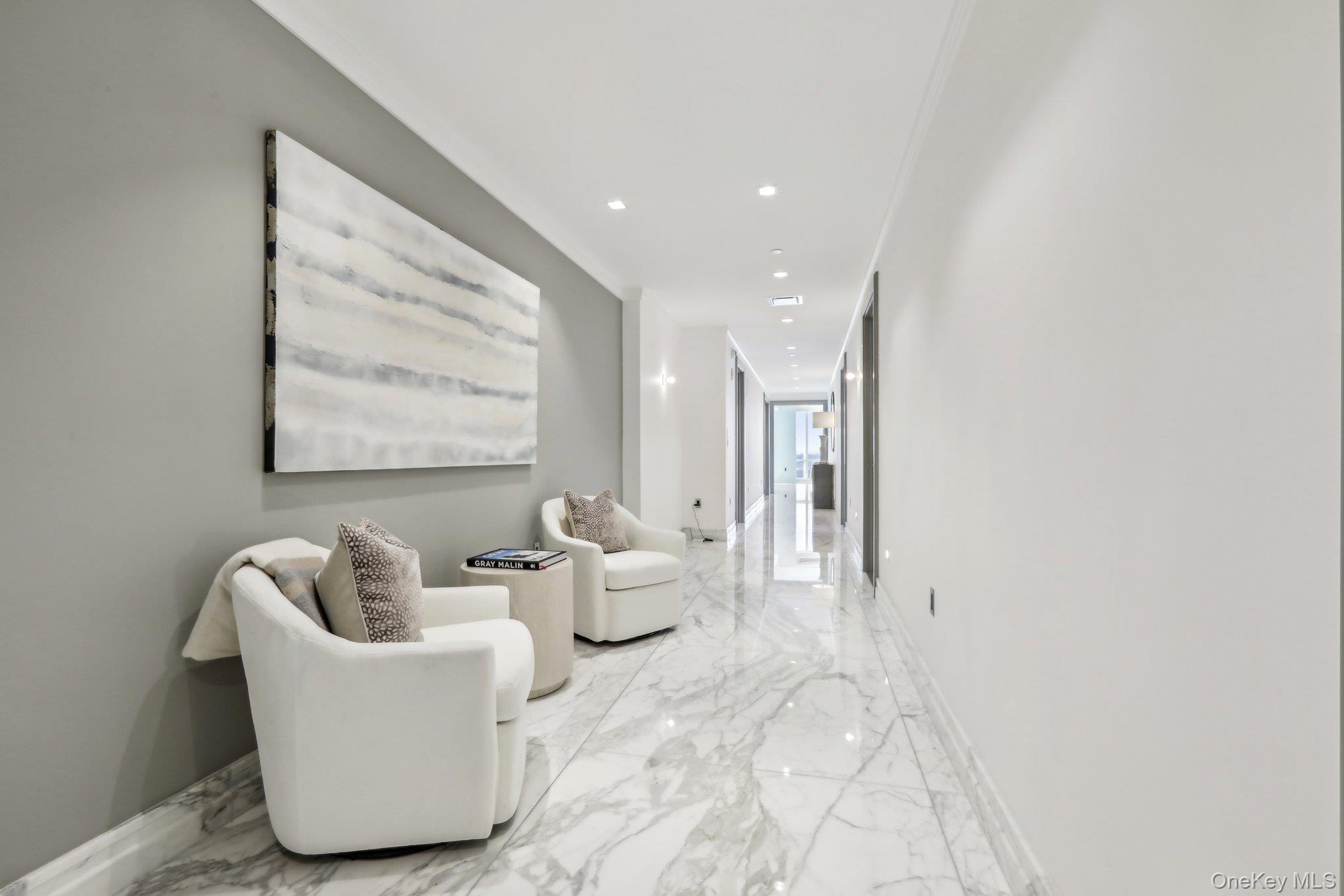 5 Renaissance Square, Unit PH41 ENT White Plains, NY 10601 - Photo 29 of 39 a living room with furniture and a large window