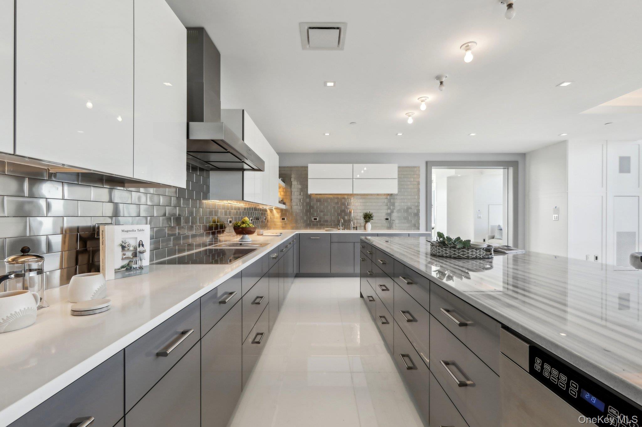 5 Renaissance Square, Unit PH41 ENT White Plains, NY 10601 - Photo 6 of 39 a large kitchen with stainless steel appliances lots of counter top space