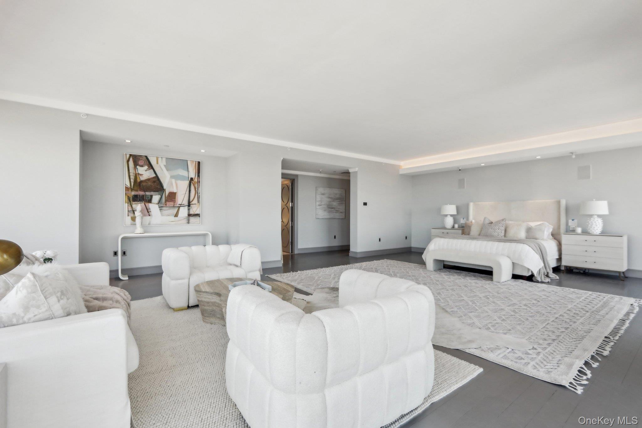 5 Renaissance Square, Unit PH41 ENT White Plains, NY 10601 - Photo 10 of 39 a bedroom with furniture and a couch