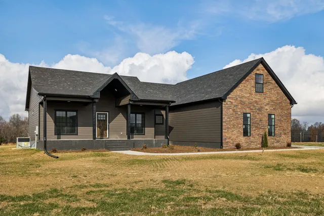 a view of a kitchen with a sink and a stove top oven