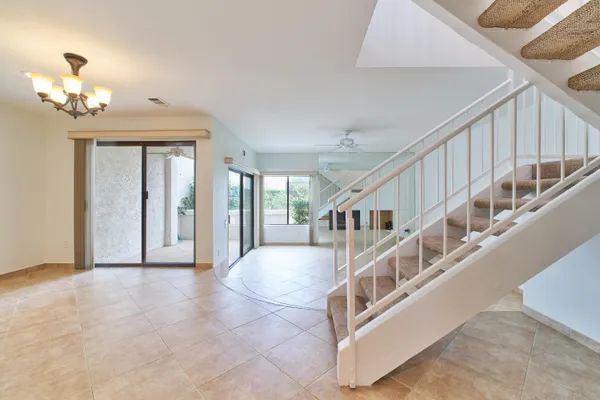 a utility room with cabinets washer and dryer