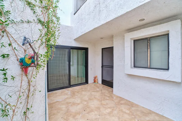 an aerial view of a house with a garden