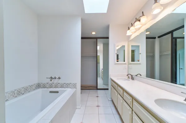 a bathroom with a shower and a glass door
