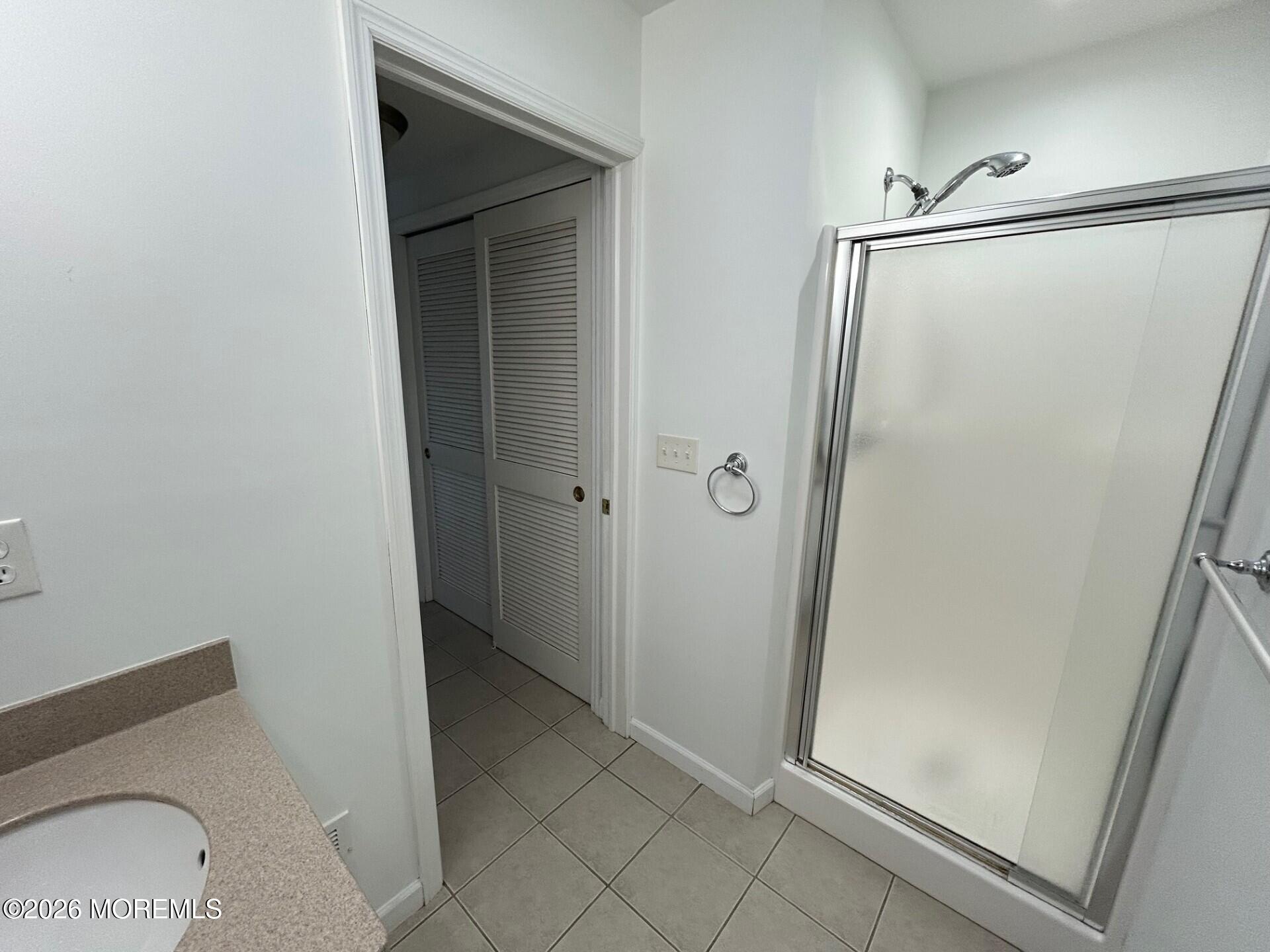 101 Main Street Farmingdale, NJ 07727 - Photo 7 of 12 a bathroom with a tub and shower