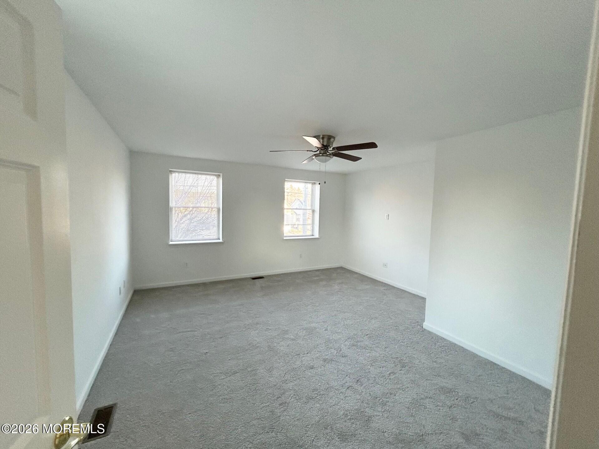 101 Main Street Farmingdale, NJ 07727 - Photo 9 of 12 an empty room with windows