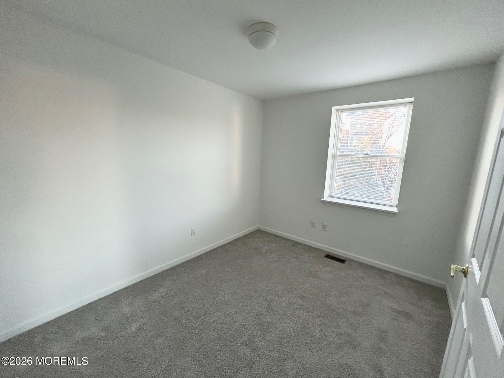 101 Main Street Farmingdale, NJ 07727 - Photo 10 of 12 an empty room with a window