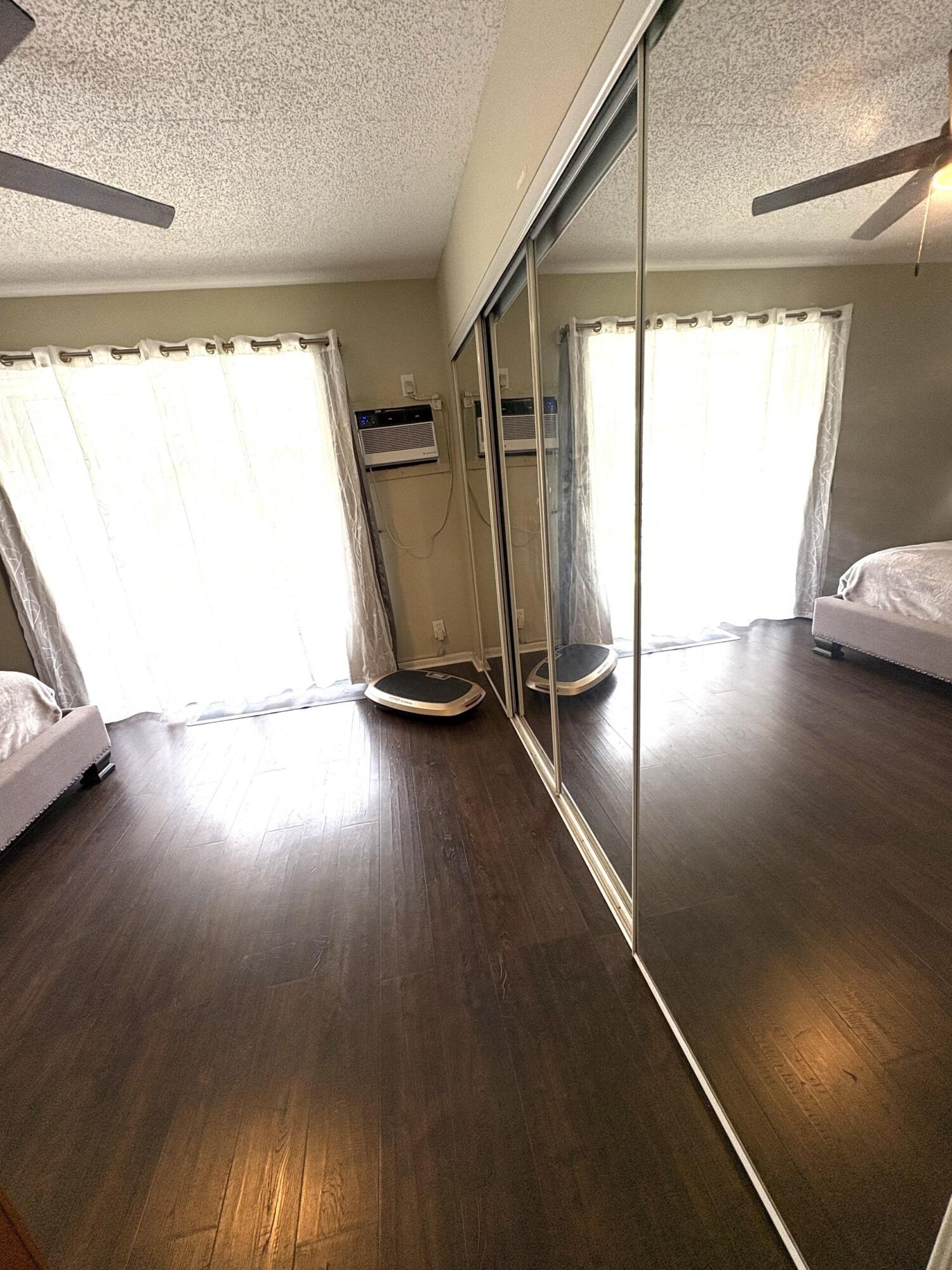 65 Preston F Boca Raton, FL 33434 - Photo 17 of 22 a view of a room with gym equipment