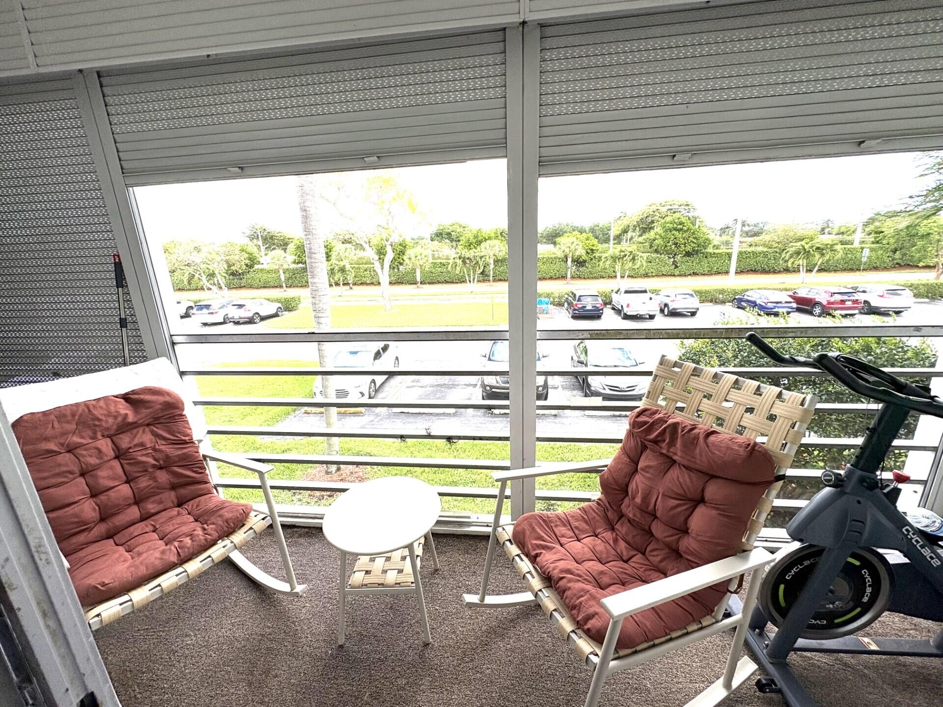 65 Preston F Boca Raton, FL 33434 - Photo 21 of 22 a living room with furniture and a large window