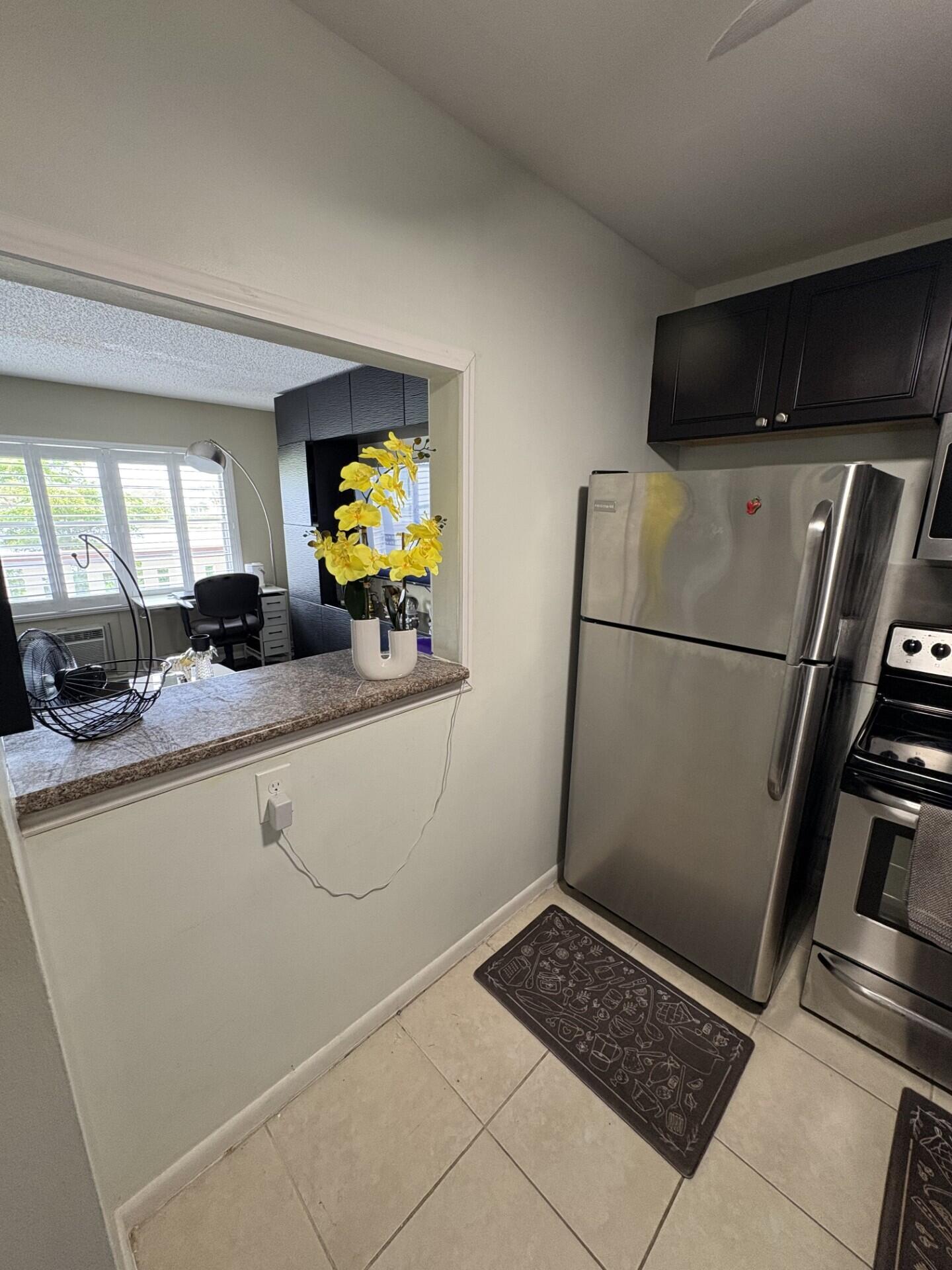 65 Preston F Boca Raton, FL 33434 - Photo 3 of 22 a bathroom with a sink a toilet and a shower