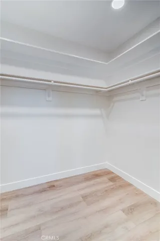 a view of a room with an empty walk in closet
