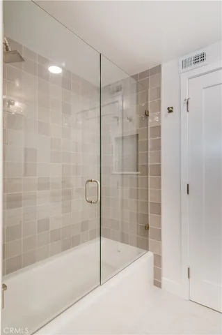 a bathroom with a shower and a bathtub