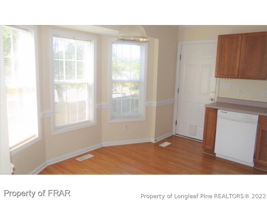 209 Pecan Trace Road Raeford, NC 28376 - Photo 14 of 31 a room with a window and wooden floor