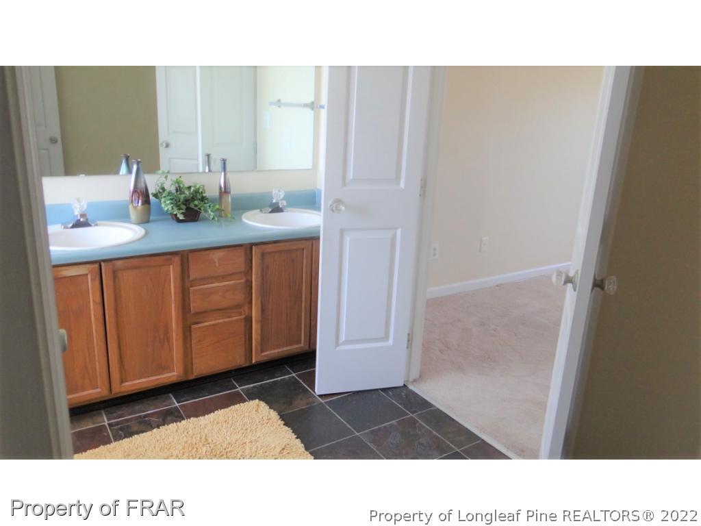 209 Pecan Trace Road Raeford, NC 28376 - Photo 19 of 31 a black and white photo of a bathroom