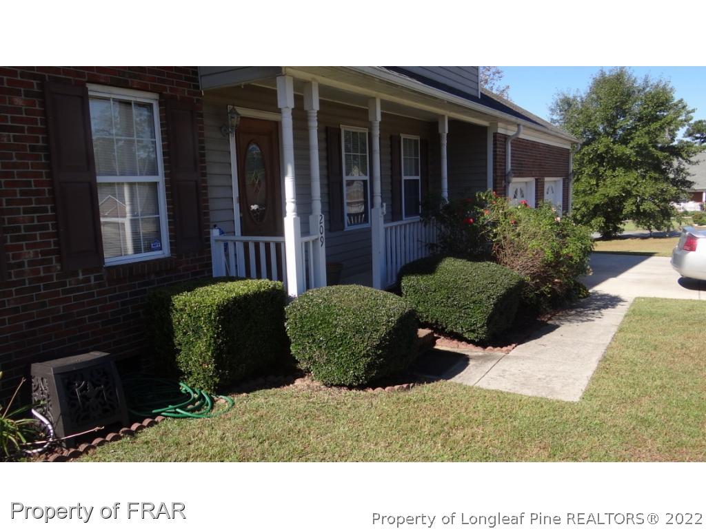 209 Pecan Trace Road Raeford, NC 28376 - Photo 2 of 31 a black and white photo of a house