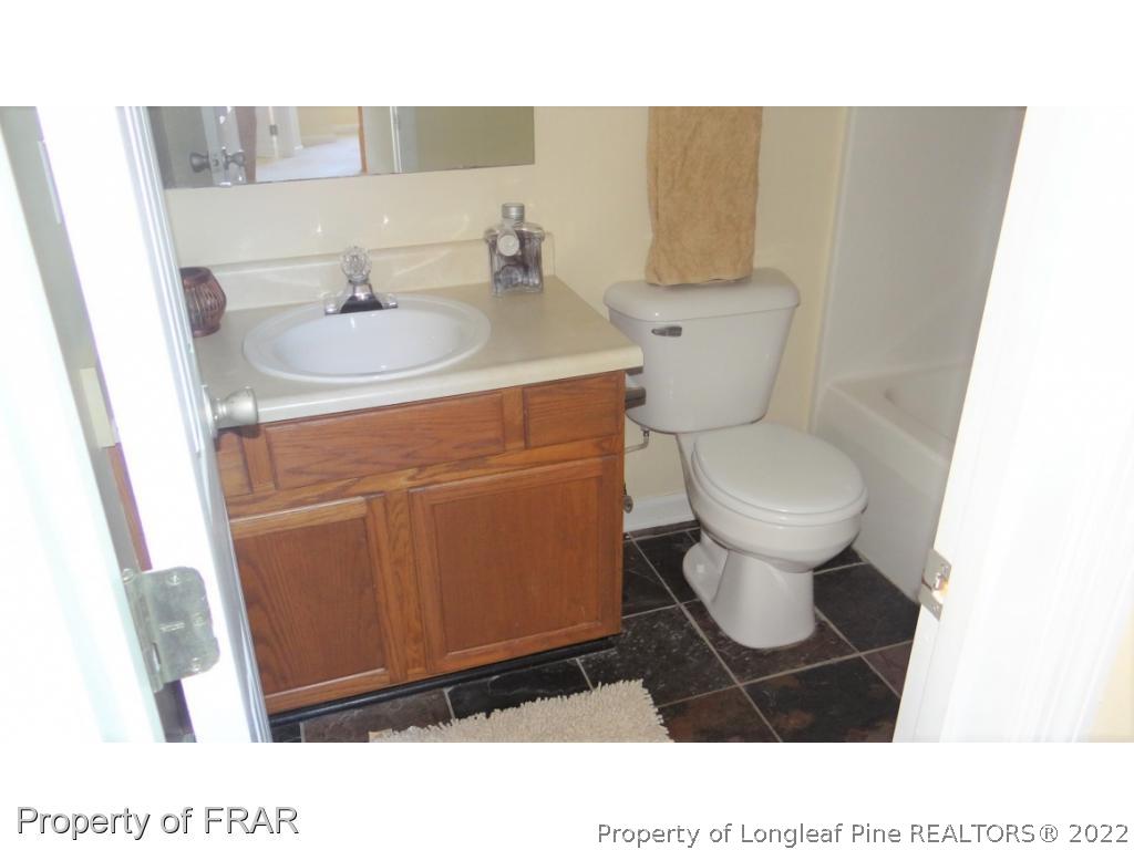 209 Pecan Trace Road Raeford, NC 28376 - Photo 24 of 31 a bathroom with a toilet and a sink