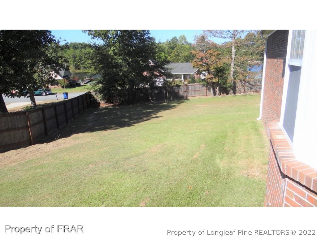 209 Pecan Trace Road Raeford, NC 28376 - Photo 27 of 31 a black and white photo of a lake