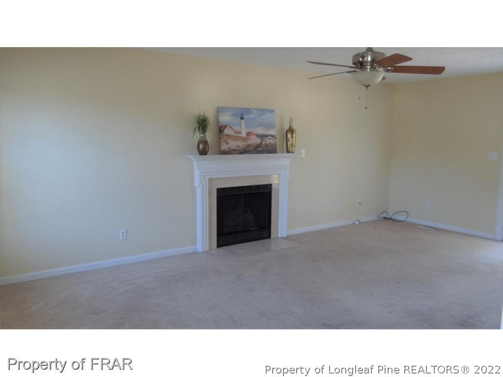 209 Pecan Trace Road Raeford, NC 28376 - Photo 4 of 31 a open living room with a fireplace