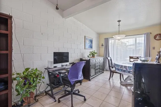 a workspace with furniture and window