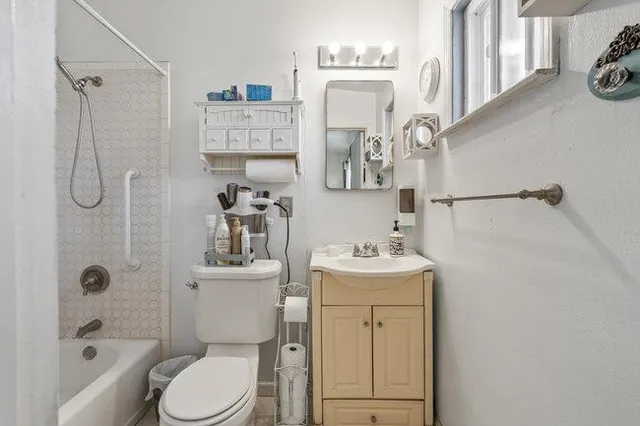 a view of a patio with table and chairs a barbeque with wooden fence