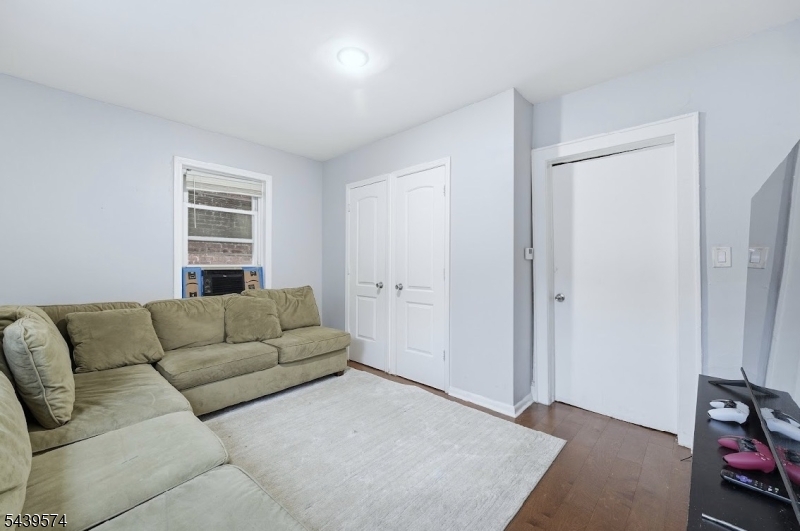 328 John Street Elizabeth, NJ 07202 - Photo 4 of 9 a living room with furniture and a window