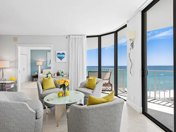 a living room with furniture and a table