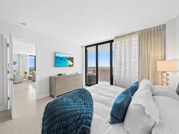 a bedroom with a bed and a couch