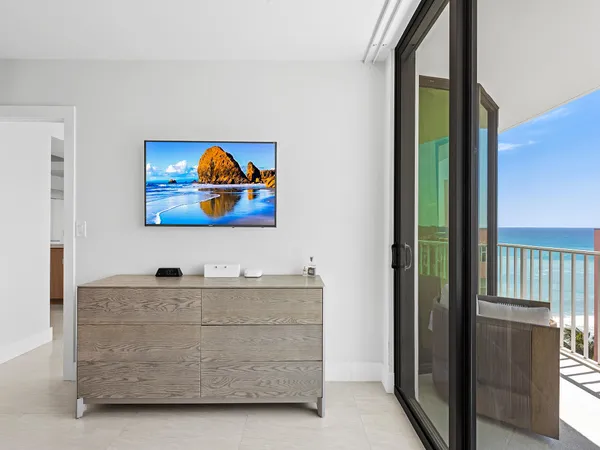 a room with a cabinet and a painting on the wall