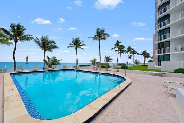 a view of a swimming pool with a patio