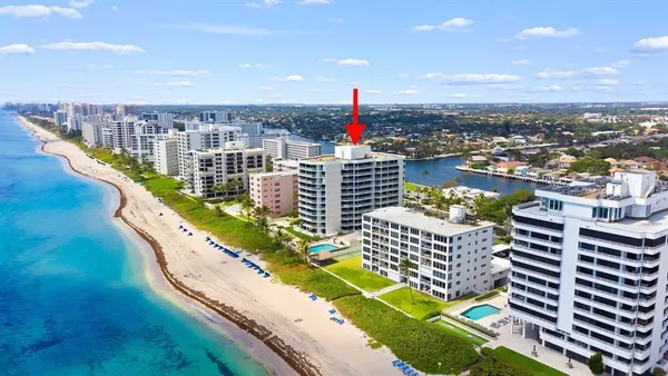 a view of a dining room with furniture wooden floor and a chandelier